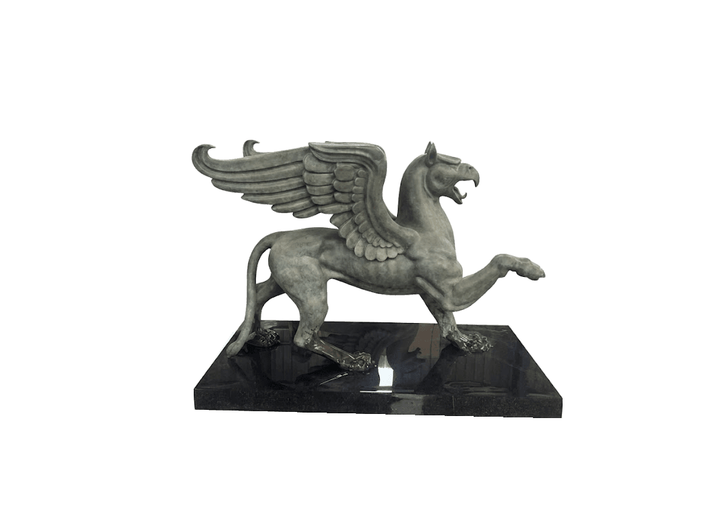 Patinated bronze winged creature on a polished black stone plinth