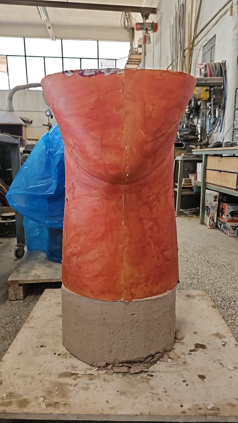 Red prepared form of the monumental sculpture in the workshop