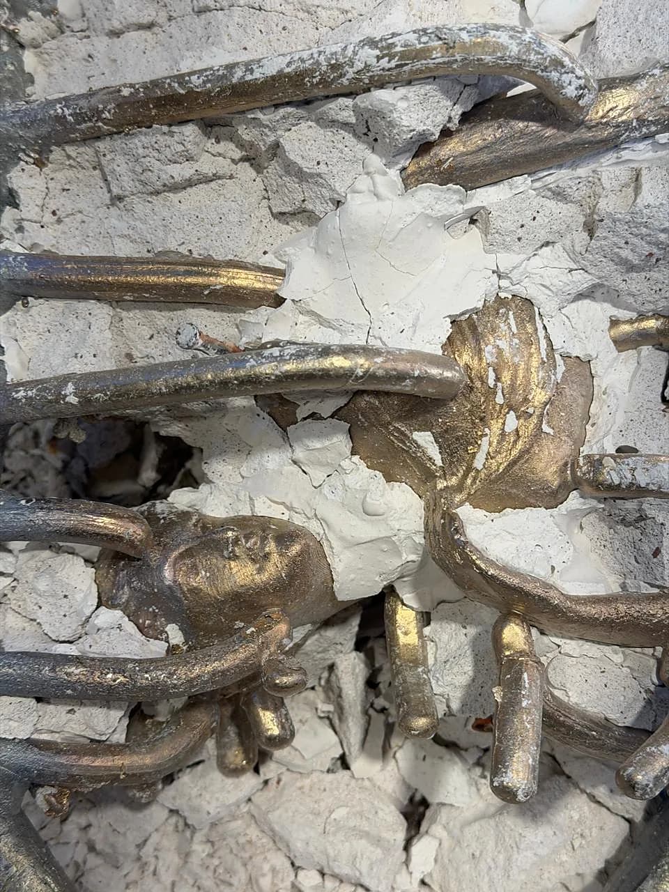 Plaster investment broken open to reveal the raw bronze cast