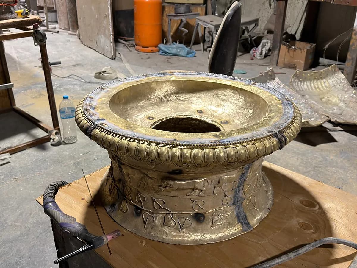 Cast bronze section on the bench during chasing